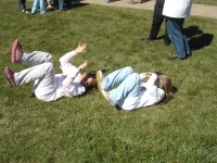 Christine & Maura rolling in grass